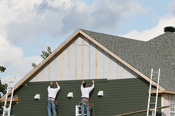 Professional Storm Damage Siding Repair technician working in Keene, TX
